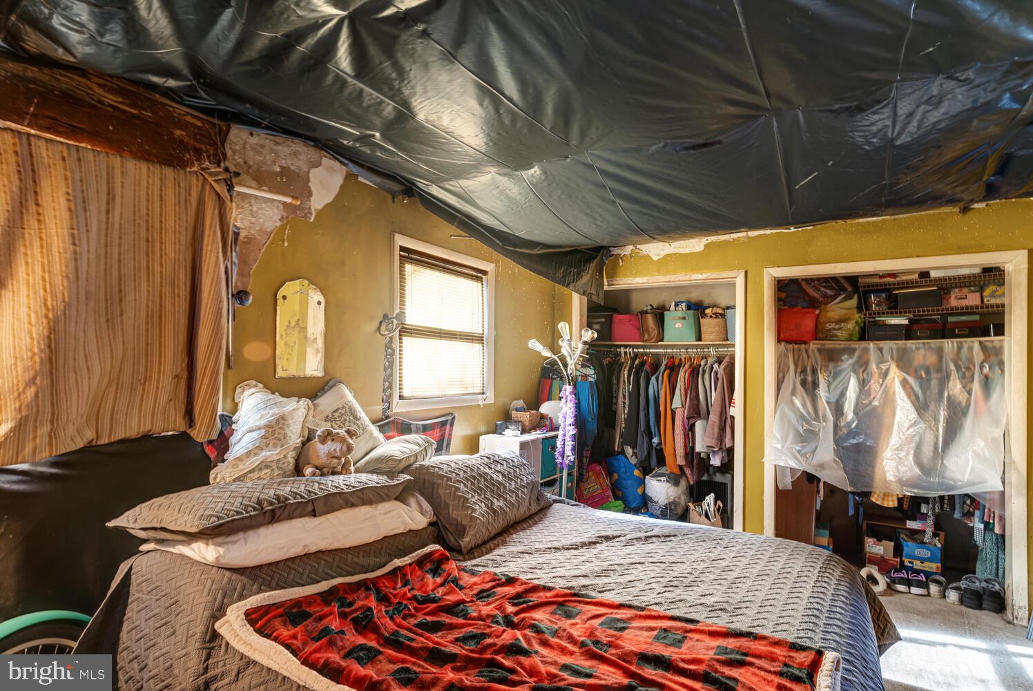 886 Radio Road Little Egg Harbor, NJ 08087 - Photo 8 of 22 a bedroom with furniture and a large window