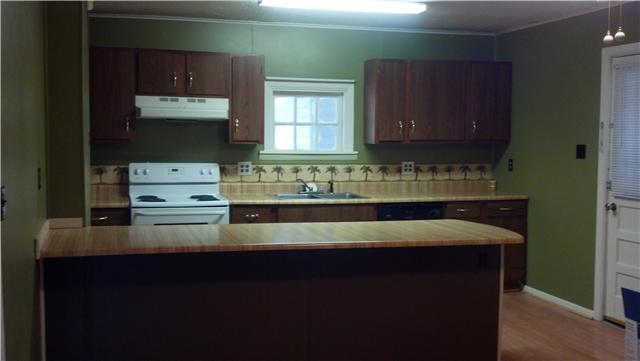 230 Reeves Street Tullahoma, TN 37388 - Photo 3 of 5 Large eat in kitchen and the extra large refrigerator stays with the property!