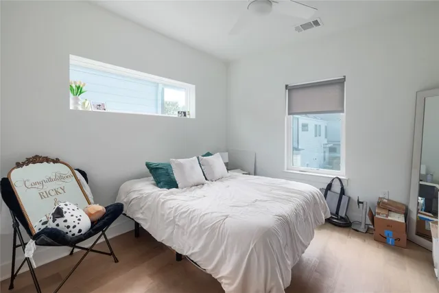 a bedroom with a bed and a window