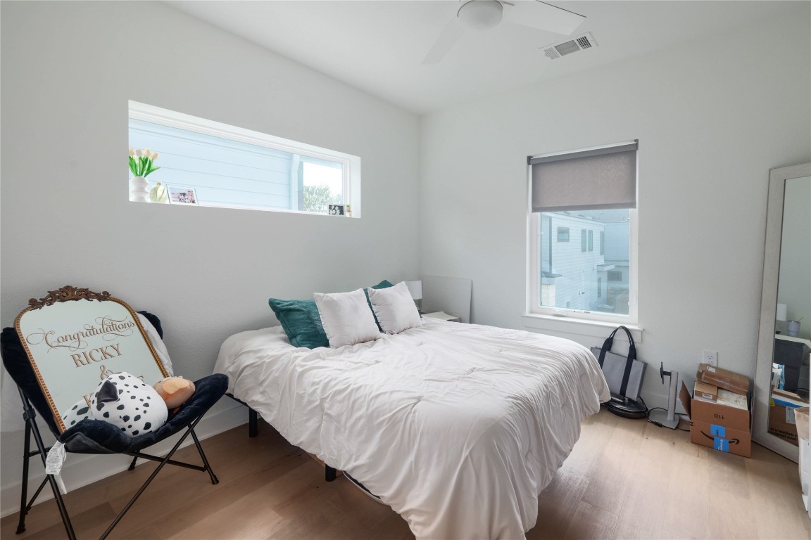 5820 Sutherlin Road, Unit 17 Austin, TX 78723 - Photo 12 of 15 a bedroom with a bed and a window