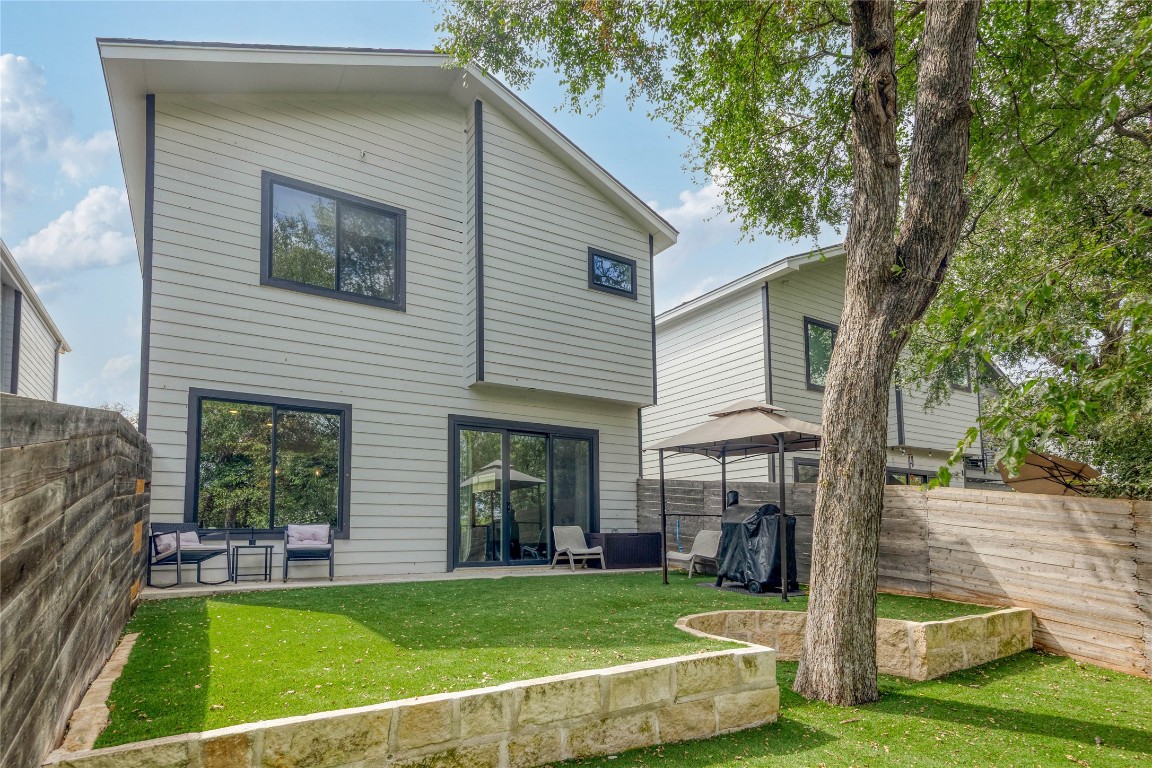 5820 Sutherlin Road, Unit 17 Austin, TX 78723 - Photo 15 of 15 a view of a house with a yard and sitting area