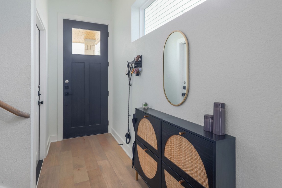 5820 Sutherlin Road, Unit 17 Austin, TX 78723 - Photo 7 of 15 a bathroom with a mirror and a sink