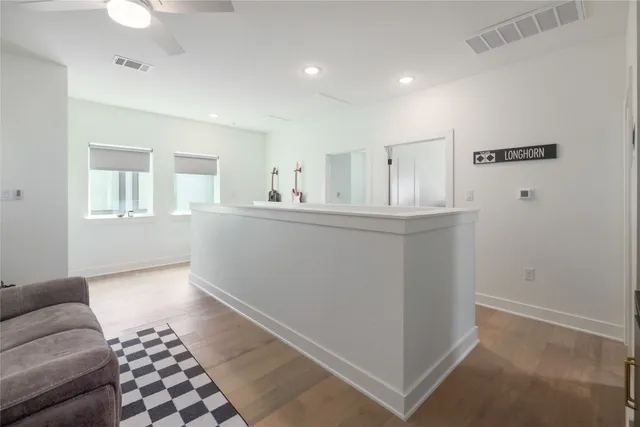 a view of a livingroom with furniture and cabinet