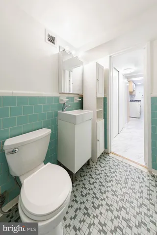 a bathroom with a toilet and a sink