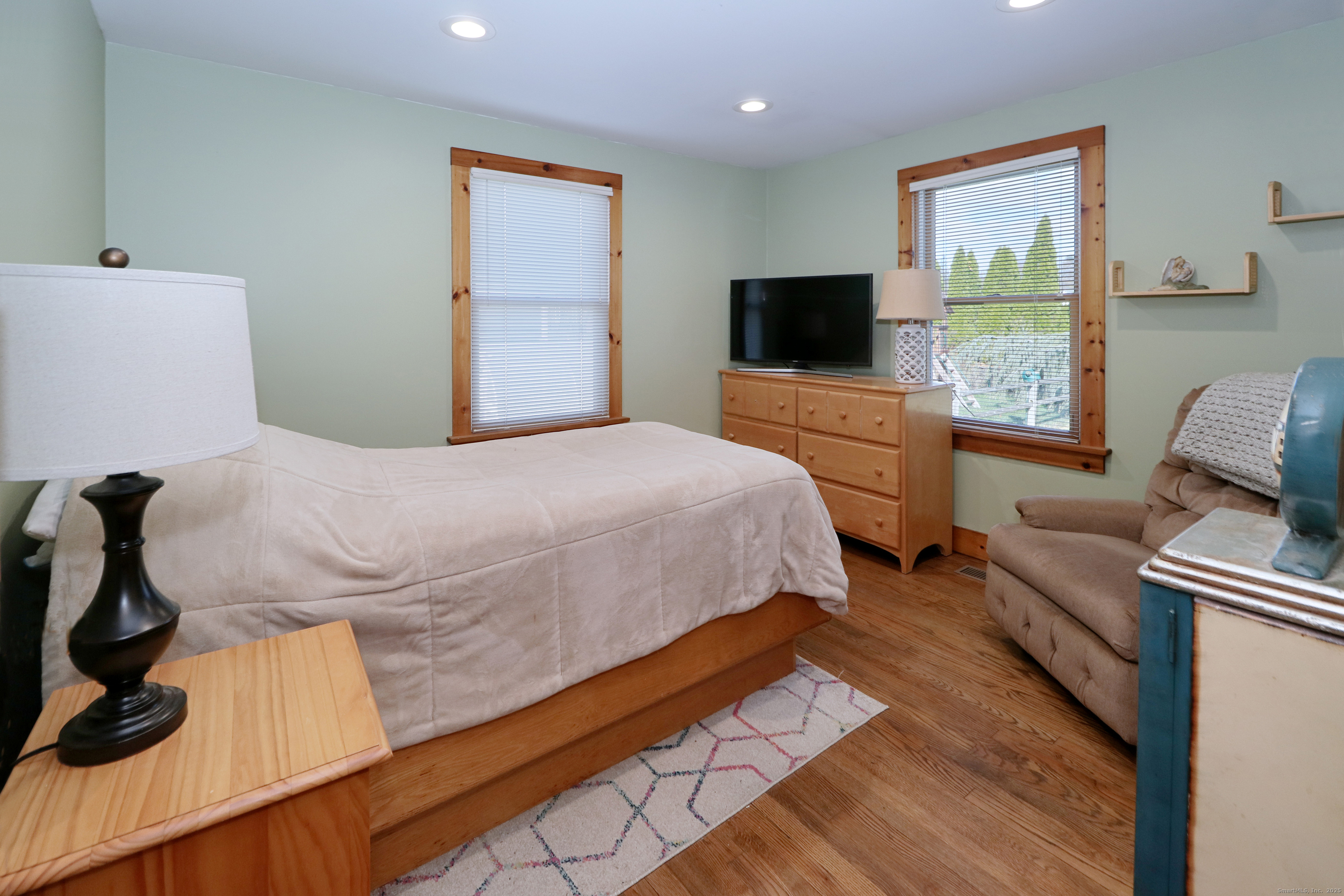 28 Stillson Place Fairfield, CT 06824 - Photo 13 of 28 a bedroom with a bed and a flat screen tv