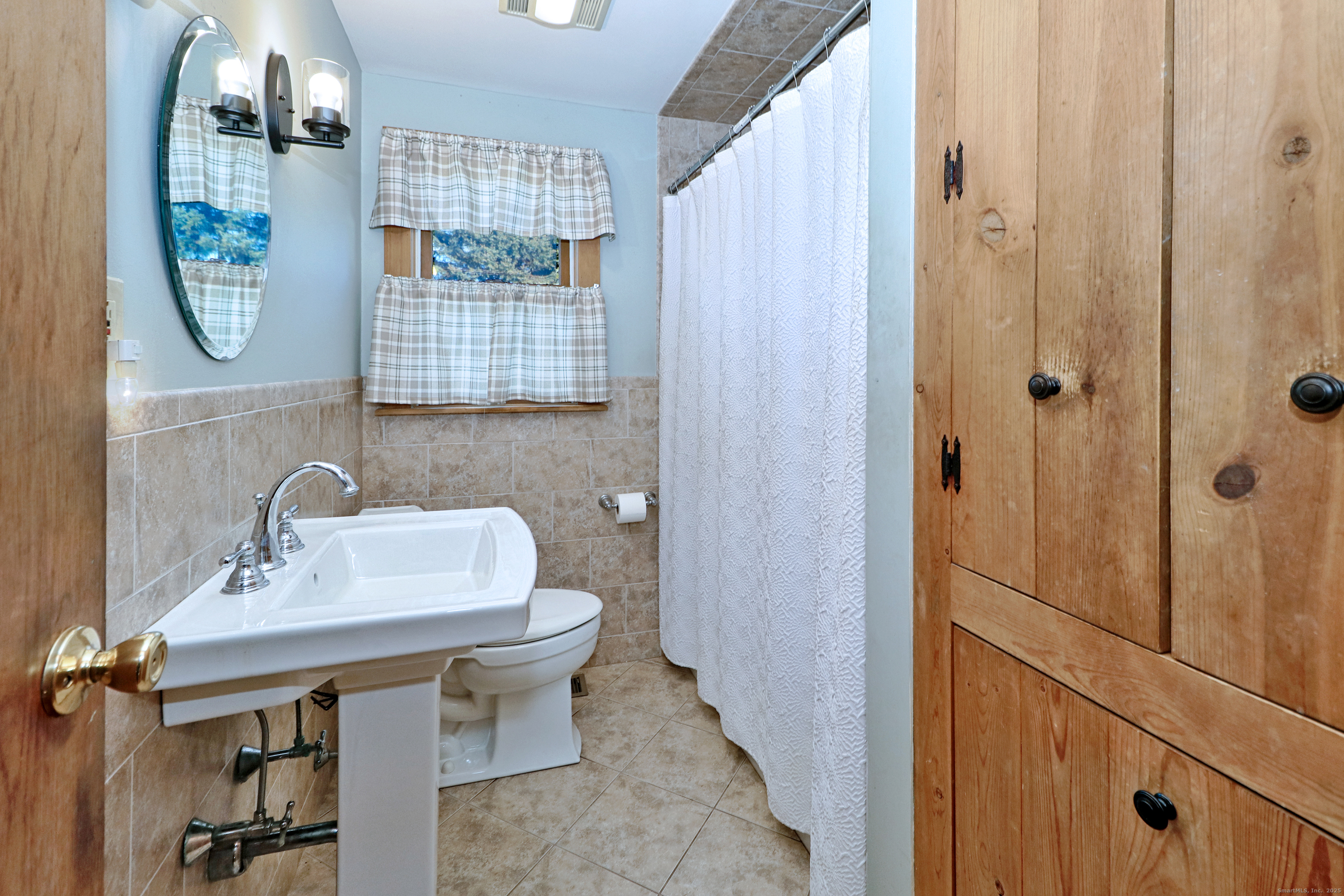 28 Stillson Place Fairfield, CT 06824 - Photo 15 of 28 a bathroom with a sink toilet and shower