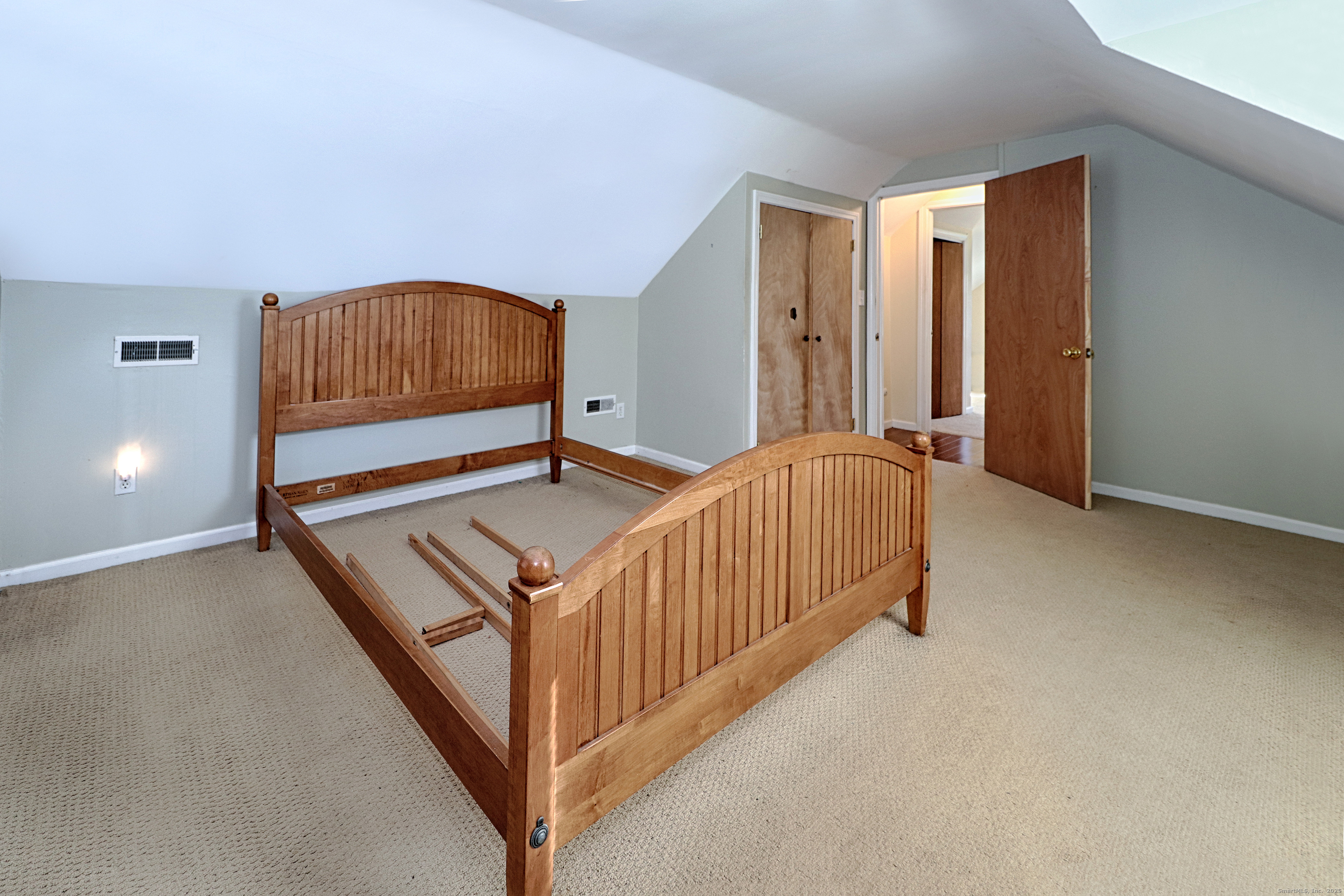 28 Stillson Place Fairfield, CT 06824 - Photo 16 of 28 a bedroom with a bed and a lamp with window