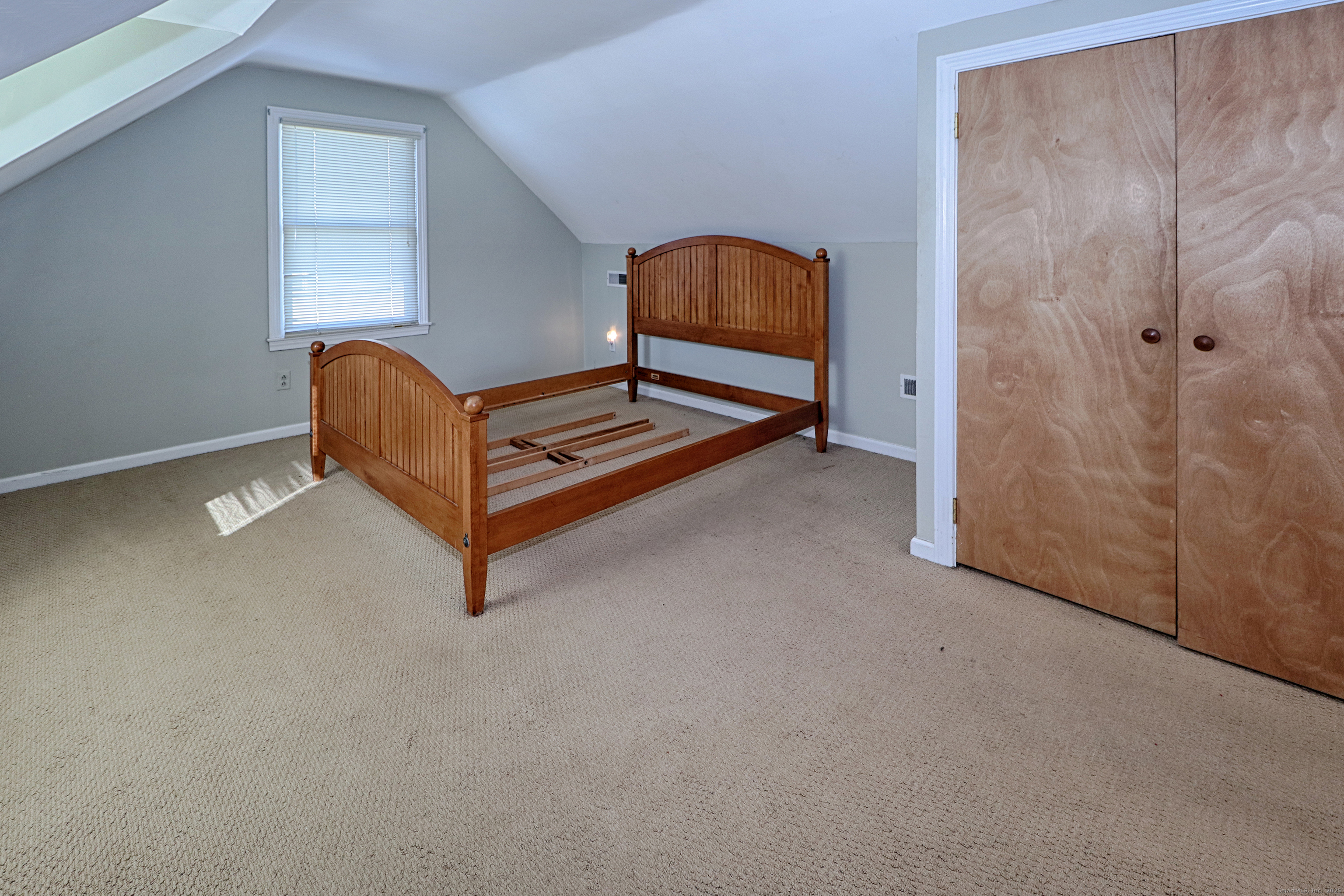 28 Stillson Place Fairfield, CT 06824 - Photo 17 of 28 a bedroom with a bed and window