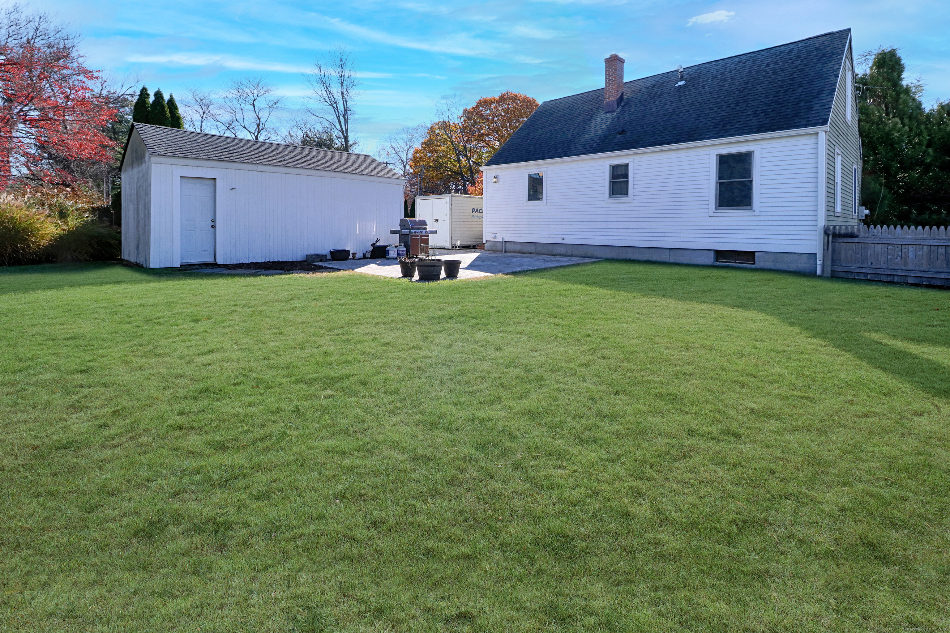 28 Stillson Place Fairfield, CT 06824 - Photo 25 of 28 a view of a house with a yard and garage
