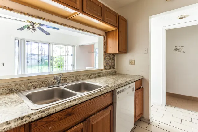 a view white cabinets and a sink