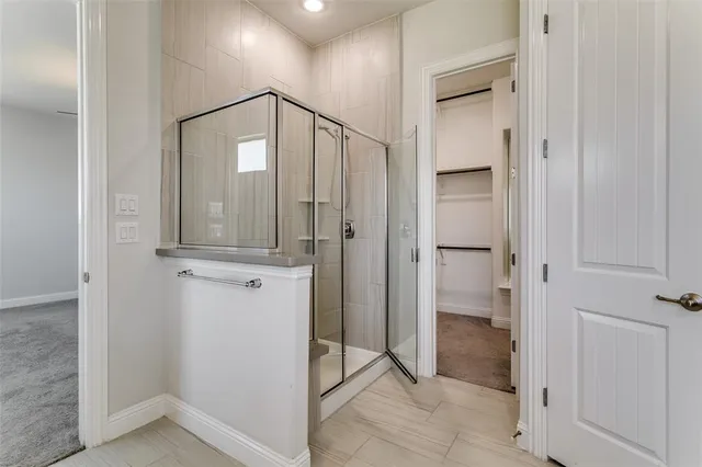 a view of a bathroom with mirror