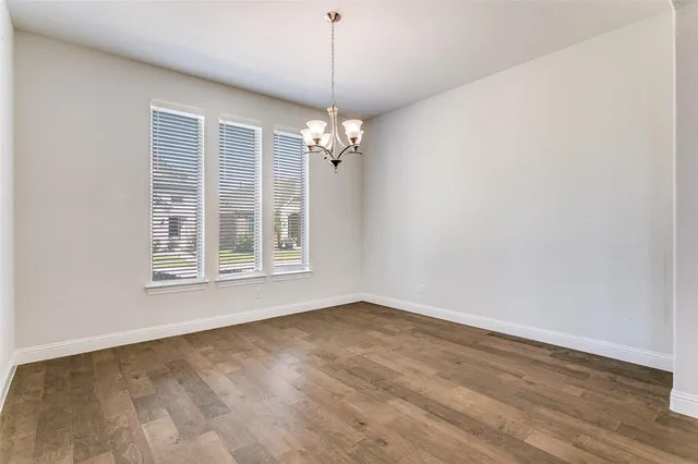 a view of a livingroom with a ceiling fan and window