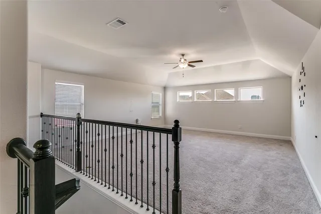 a view of hallway with windows