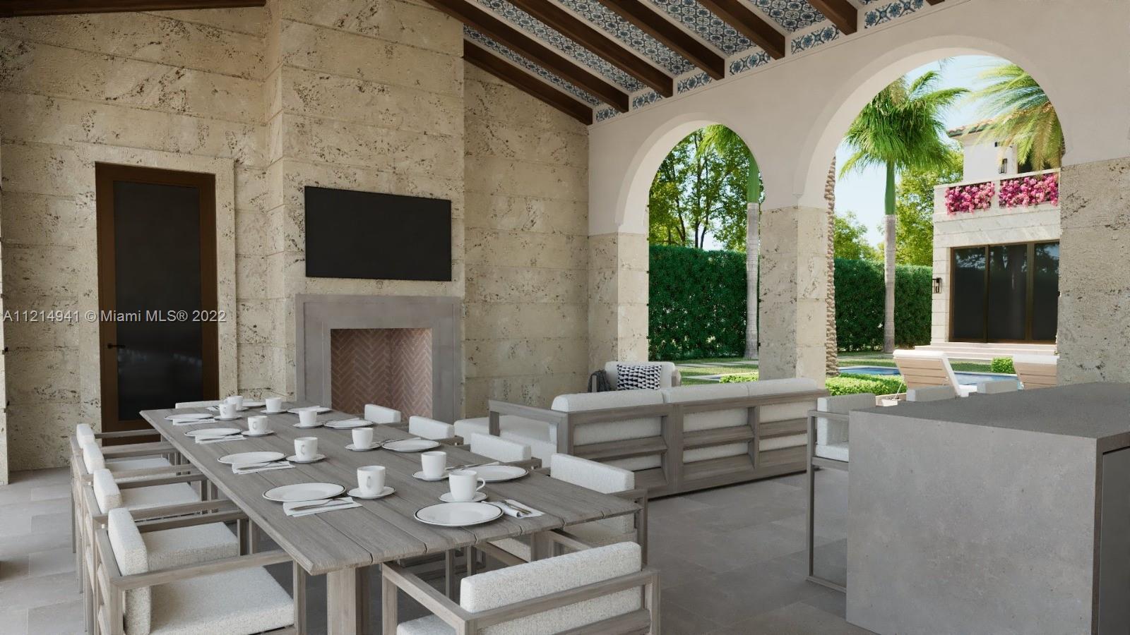 4525 Pine Tree Drive Miami Beach, FL 33140 - Photo 7 of 19 a dinning table and chairs in a patio