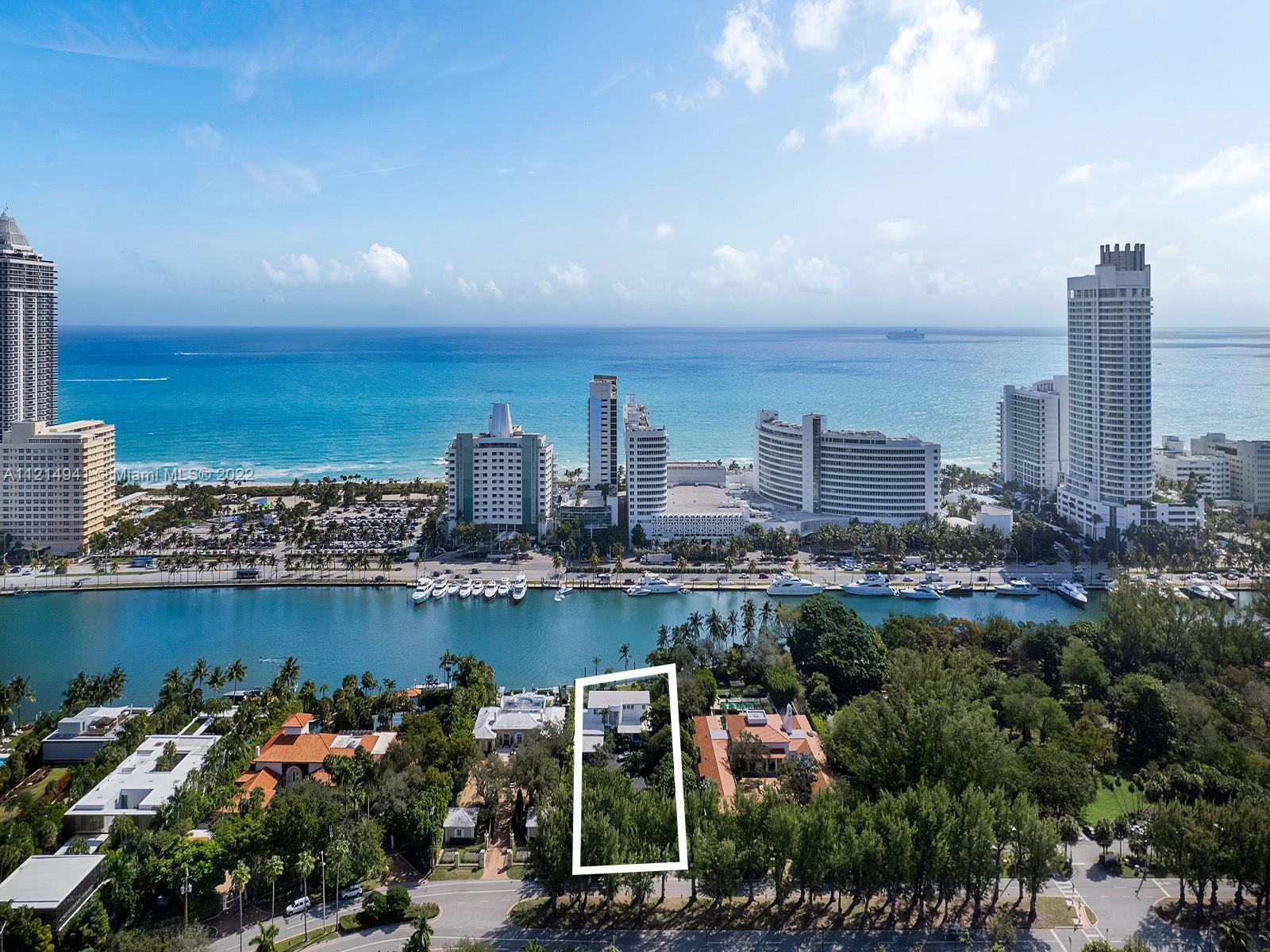 4525 Pine Tree Drive Miami Beach, FL 33140 - Photo 9 of 19 a view of a city with lawn chairs
