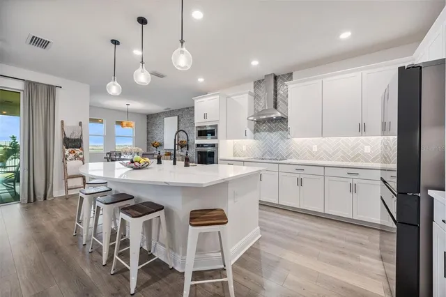 a room with lots of books and a shelf