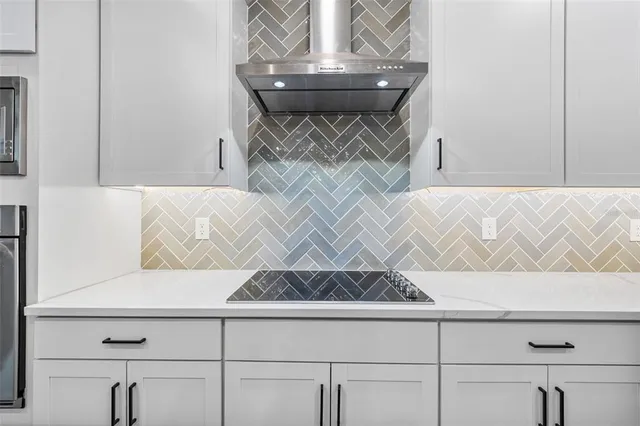 a bathroom with a shower and a glass door