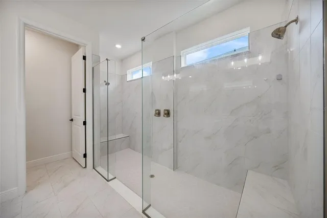 a view of a porch with furniture and a yard