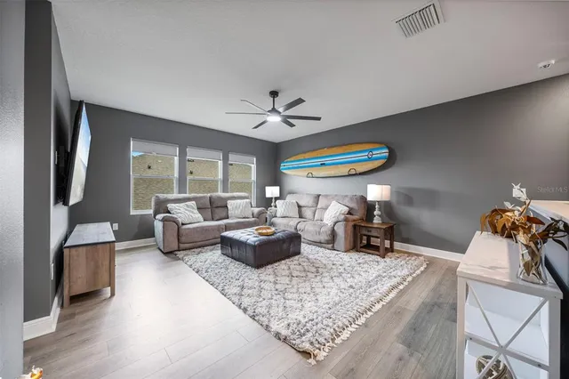 an aerial view of a house with a lake view