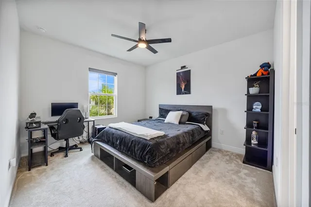 an aerial view of residential houses with outdoor space and swimming pool