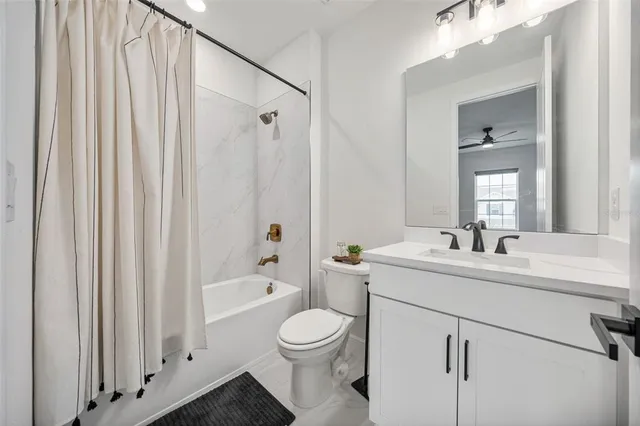 a picture of a bathroom with a shower