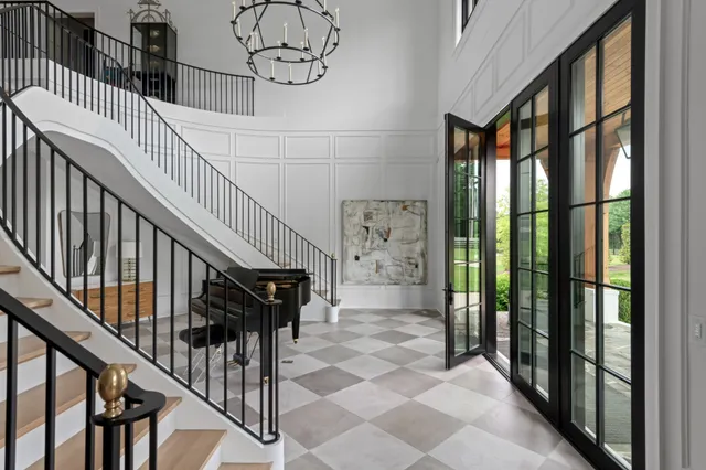 a kitchen with kitchen island granite countertop a stove a sink and a refrigerator