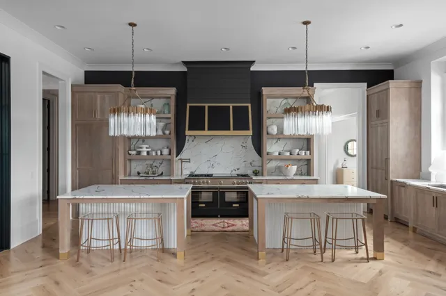 a living room with furniture large window and wooden floor