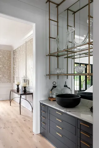 a kitchen with white cabinets and appliances
