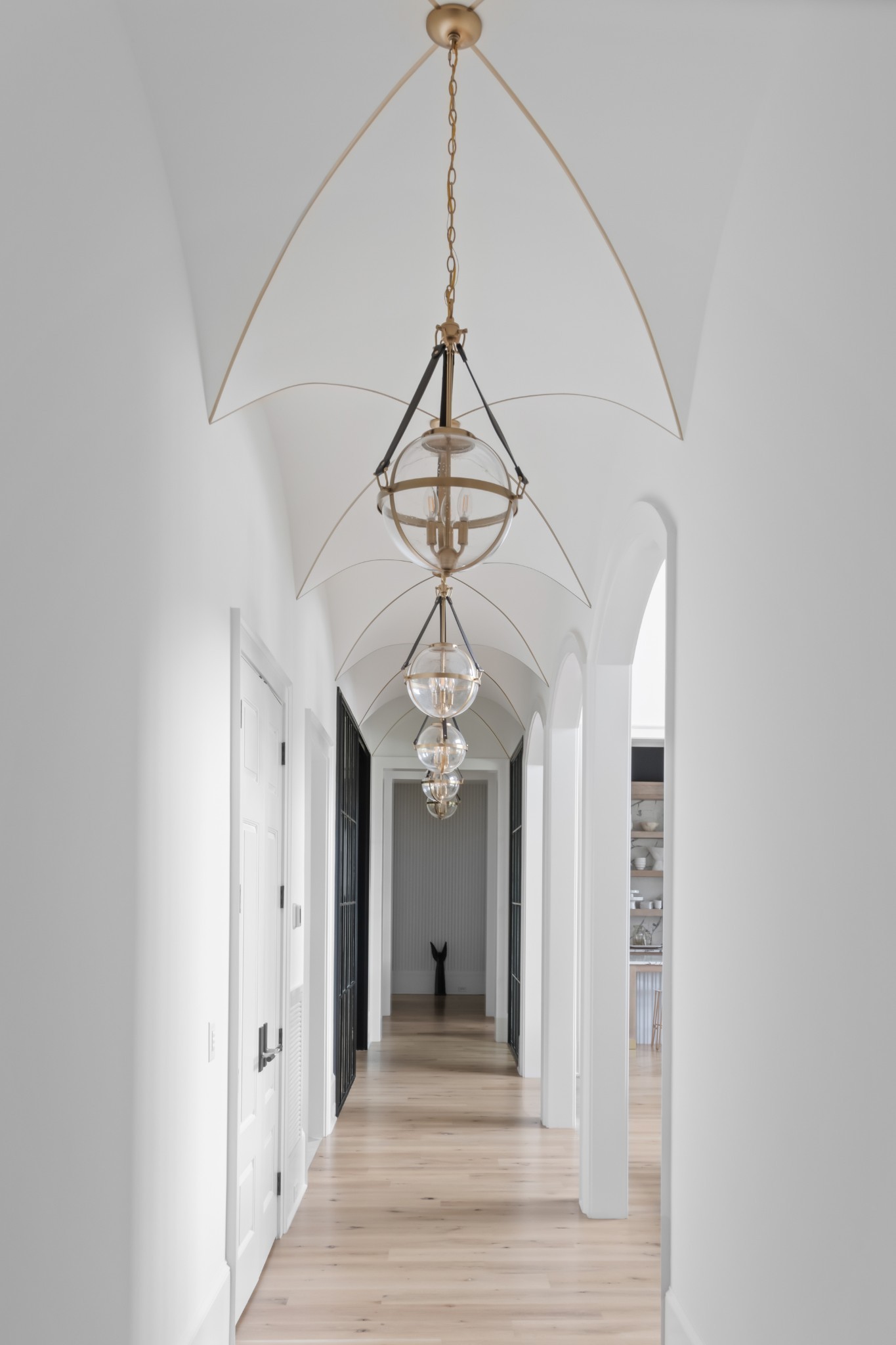 1561 Sunset Road Brentwood, TN 37027 - Photo 21 of 67 a view of a hallway with wooden floor and a chandelier