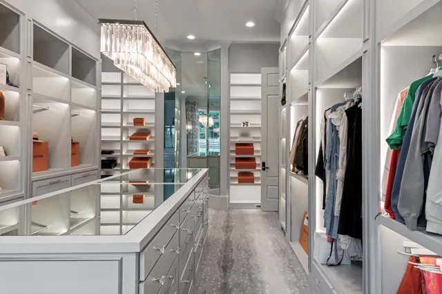 a kitchen with stainless steel appliances granite countertop a refrigerator and a stove