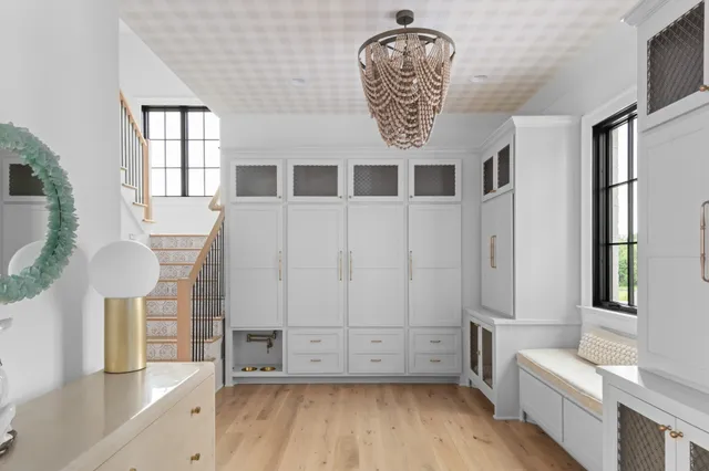 a room with lots of furniture and windows