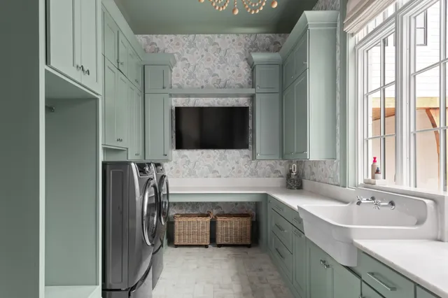 a room with gym equipment and a flat screen tv