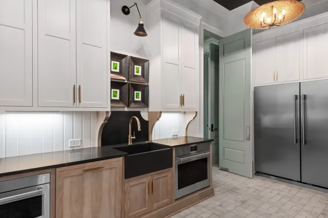 a kitchen with stainless steel appliances granite countertop a stove and a sink