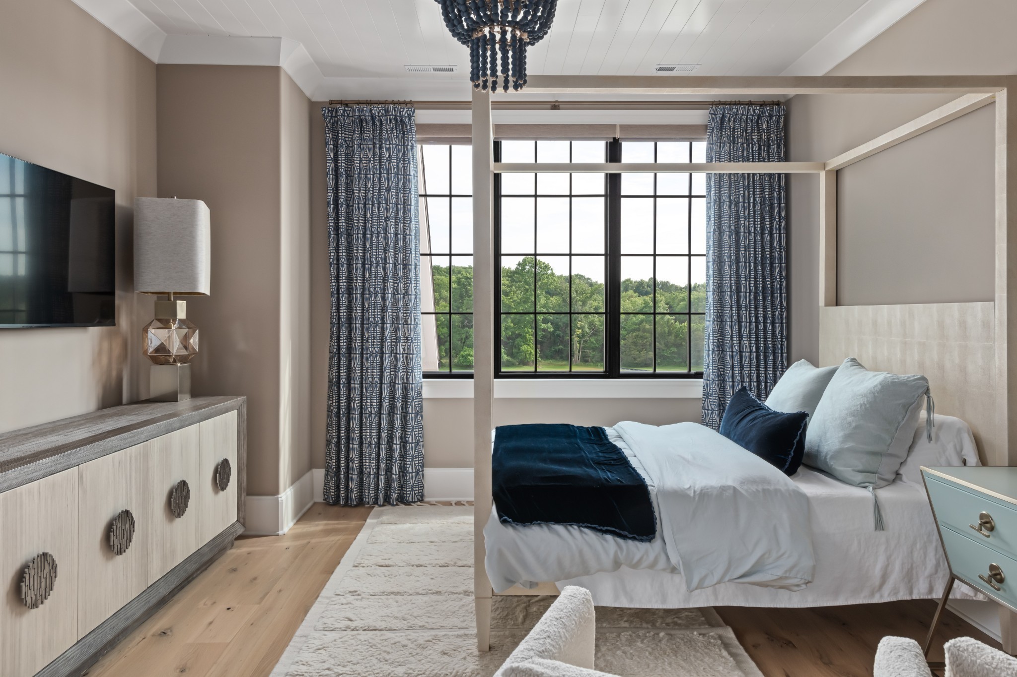 1561 Sunset Road Brentwood, TN 37027 - Photo 49 of 67 a bedroom with a large bed and a chandelier