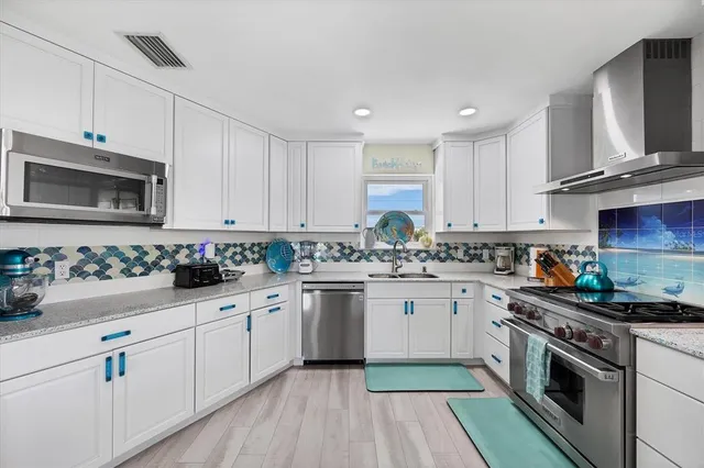 a bedroom with a bed and a dresser in it