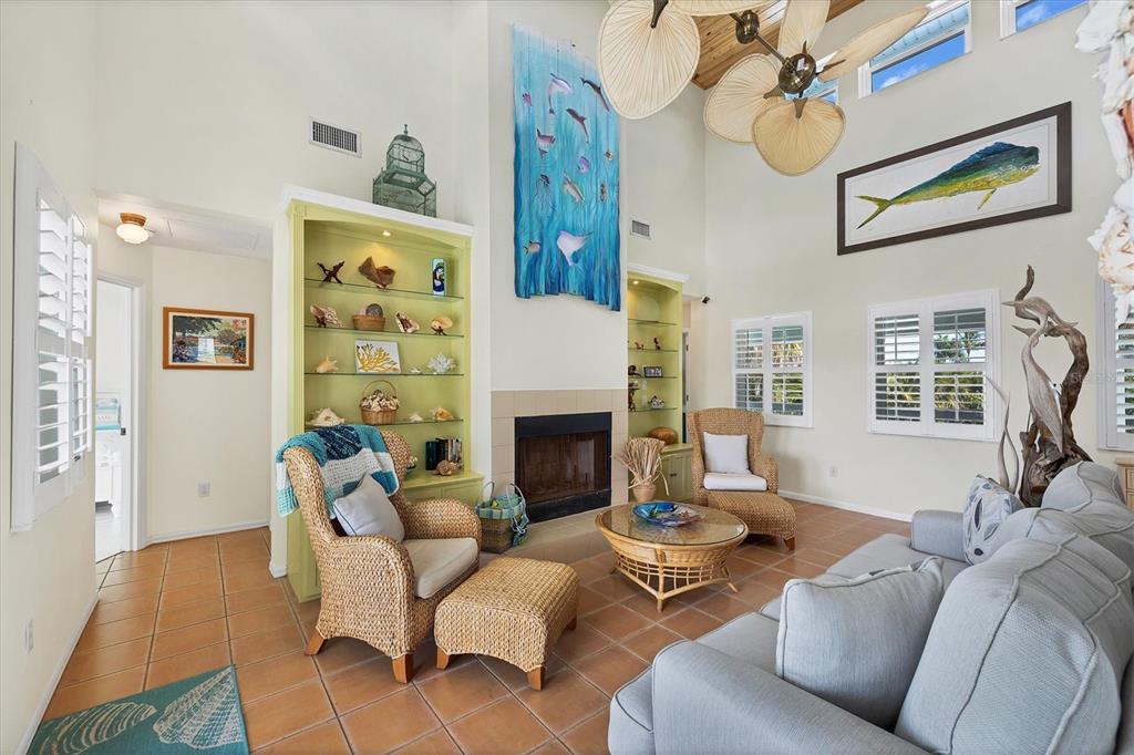 3547 Gasparilla Road Boca Grande, FL 33921 - Photo 15 of 43 a living room with furniture and a fireplace