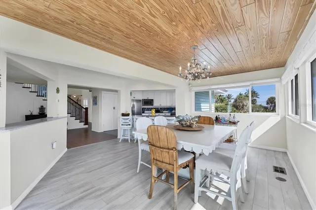 a spacious bathroom with a granite countertop sink and a mirror