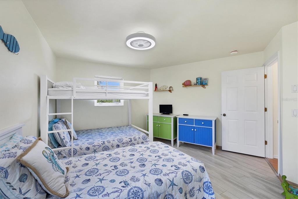 3547 Gasparilla Road Boca Grande, FL 33921 - Photo 17 of 43 a room with a bed and a dresser
