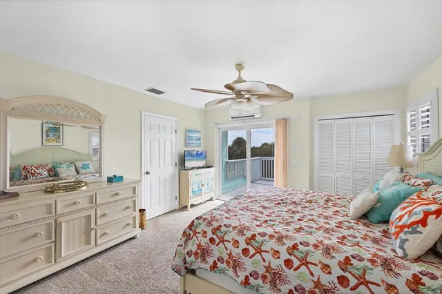a view of a porch with furniture and wooden floor