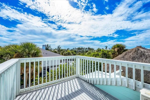 a view of a balcony with chairs