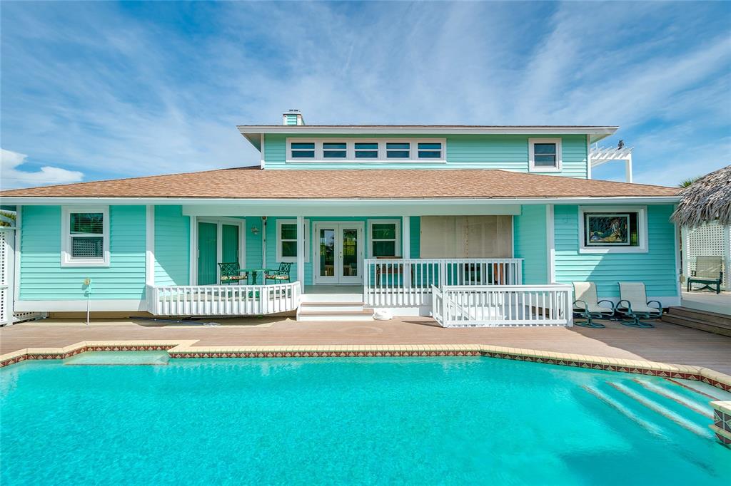 3547 Gasparilla Road Boca Grande, FL 33921 - Photo 32 of 43 a front view of a house with a garden