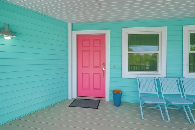 a kitchen with granite countertop stainless steel appliances and white cabinets