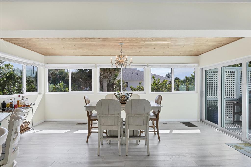 3547 Gasparilla Road Boca Grande, FL 33921 - Photo 10 of 43 a view of a dining room with furniture window and outside view