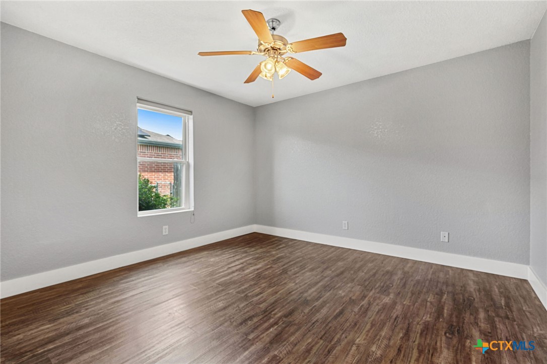 3208 Viewcrest Drive Killeen, TX 76549 - Photo 10 of 15 wooden floor in an empty room with a window