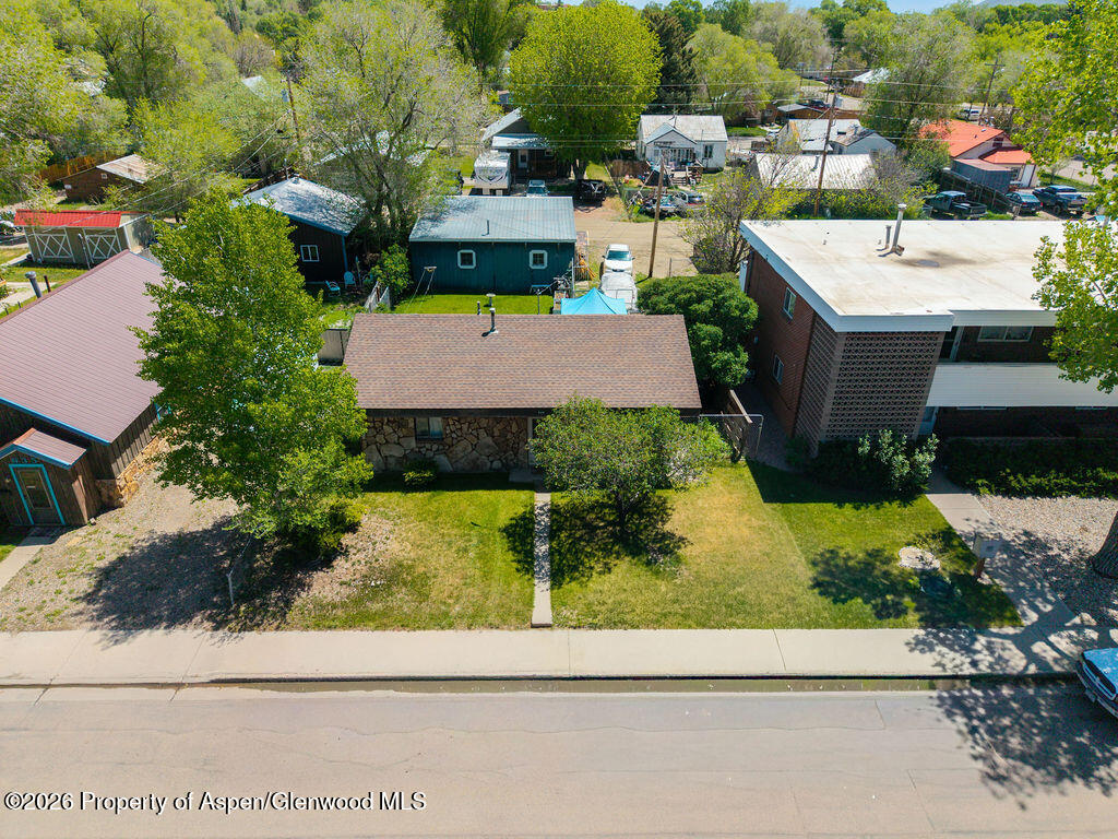 625 Russell Street Craig, CO 81625 - Photo 7 of 35 an aerial view of a house with a yard and trees