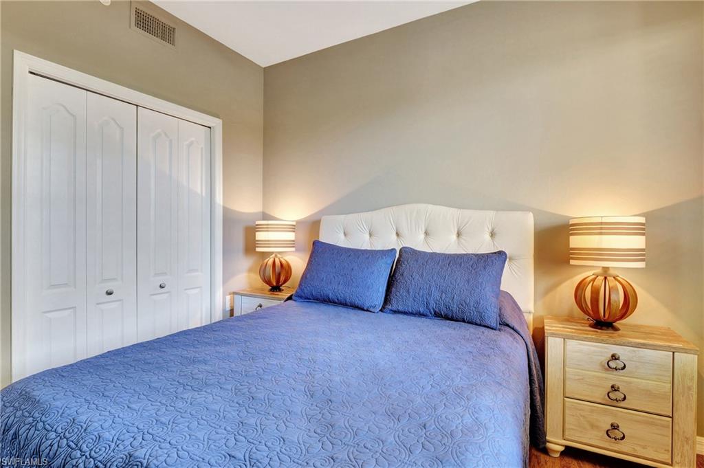 8600 Cedar Hammock Circle, Unit 1313 Naples, FL 34112 - Photo 23 of 41 a bedroom with a bed and closet