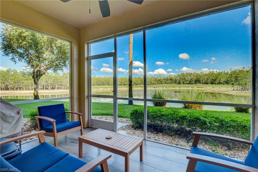 8600 Cedar Hammock Circle, Unit 1313 Naples, FL 34112 - Photo 27 of 41 a living room with patio area and garden view