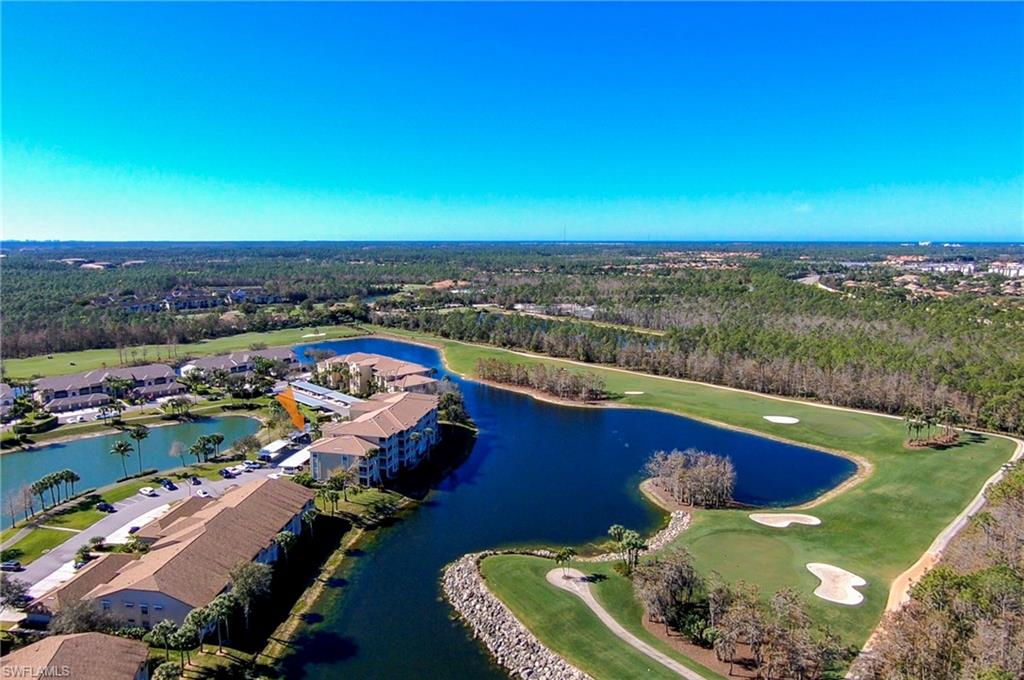 8600 Cedar Hammock Circle, Unit 1313 Naples, FL 34112 - Photo 36 of 41 a view of a swimming pool and lake view