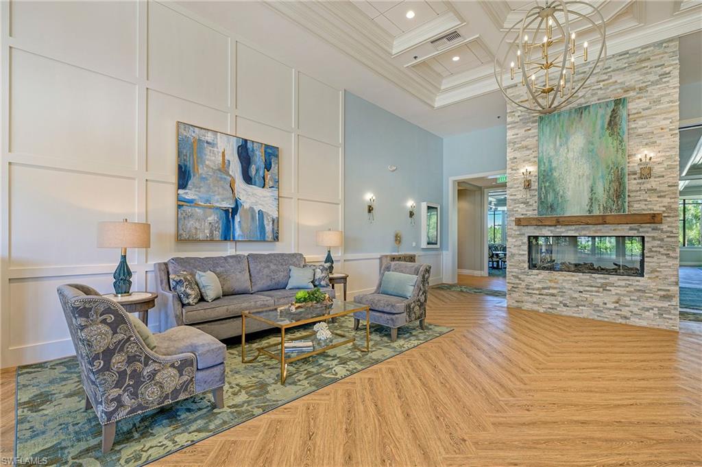 8600 Cedar Hammock Circle, Unit 1313 Naples, FL 34112 - Photo 40 of 41 a living room with furniture and a fireplace