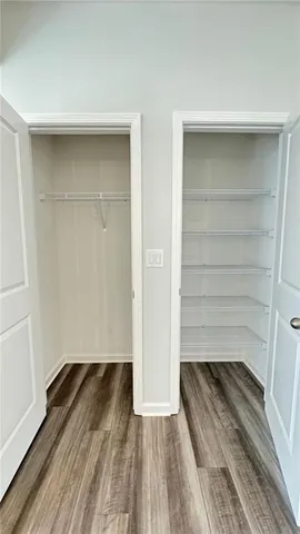 a view of a room with wooden floor and closet